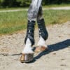 The WeatherBeeta Hard Shell Dressage Boots feature an absorbent and comfortable 3D mesh to wick away moisture and keep the leg dry while shaped perfectly to fit the horses leg
